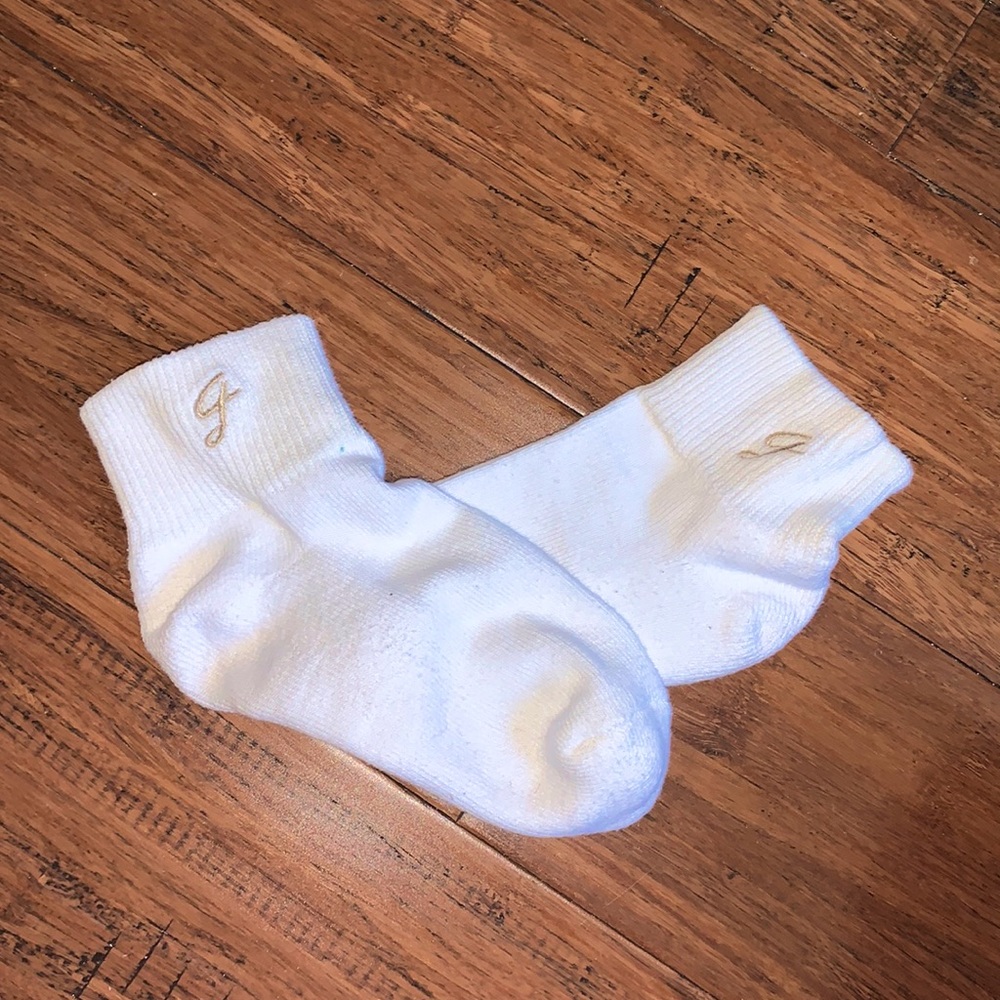 White socks with gold emblem